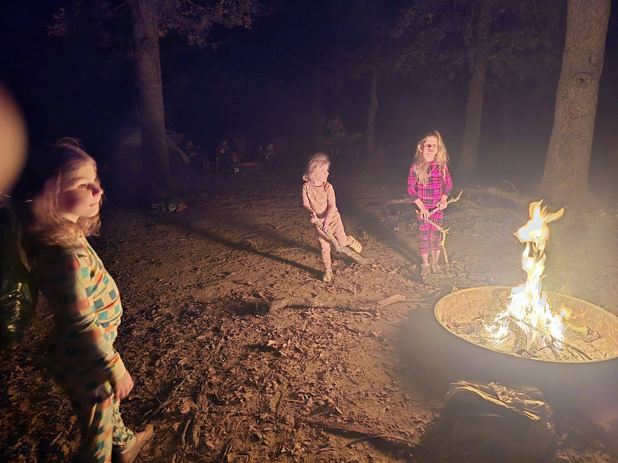 Children gathering around a fire